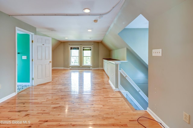 1348 Union St, Schenectady, NY 12308 - additional living space with wood finished floors, vaulted ceiling, baseboards, and a baseboard radiator