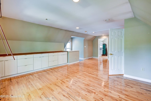 1348 Union St, Schenectady, NY 12308 - empty room with vaulted ceiling, light wood-style flooring, baseboards, and recessed lighting