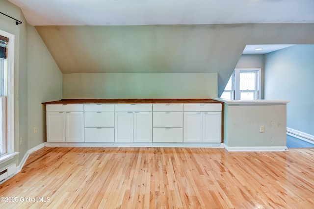1348 Union St, Schenectady, NY 12308 - additional living space featuring vaulted ceiling, light wood-style flooring, and baseboards