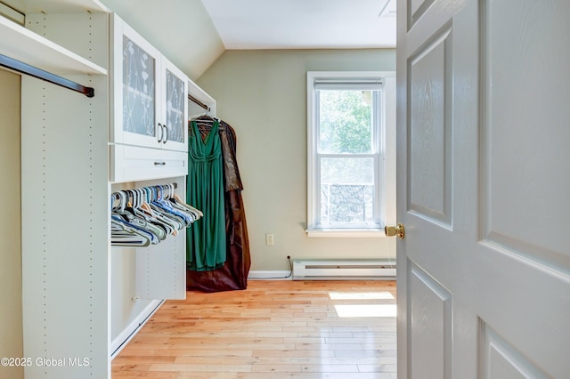 1348 Union St, Schenectady, NY 12308 - walk in closet featuring a baseboard heating unit, light wood-style floors, and lofted ceiling