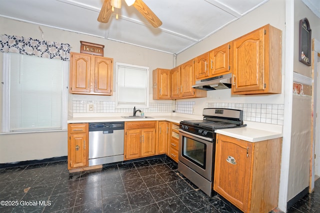 1526 6th Ave, Watervliet, NY 12189 - kitchen with appliances with stainless steel finishes, under cabinet range hood, a ceiling fan, light countertops, and decorative backsplash