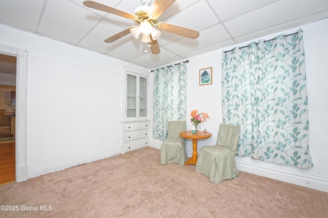 1526 6th Ave, Watervliet, NY 12189 - living area featuring carpet, a paneled ceiling, and a ceiling fan