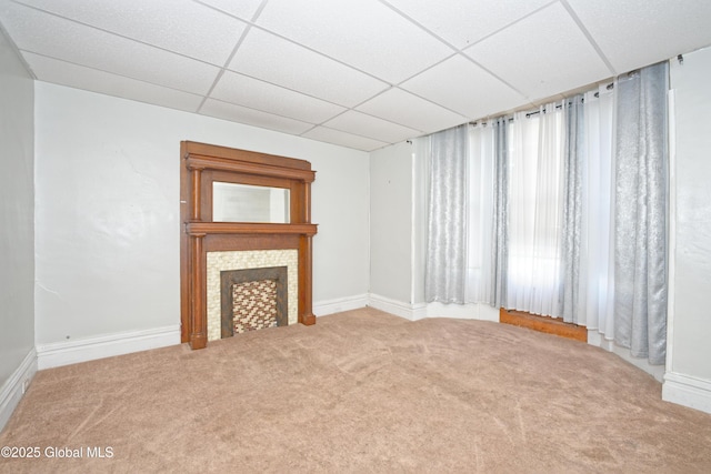 1526 6th Ave, Watervliet, NY 12189 - unfurnished living room featuring carpet flooring, a paneled ceiling, and a tile fireplace