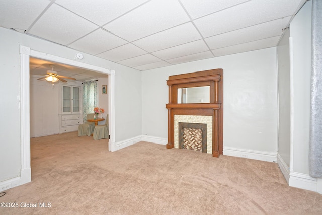1526 6th Ave, Watervliet, NY 12189 - unfurnished living room featuring carpet floors, a drop ceiling, a fireplace, and ceiling fan