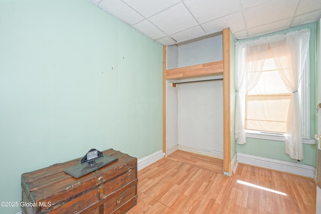 1526 6th Ave, Watervliet, NY 12189 - unfurnished bedroom with wood finished floors and a drop ceiling