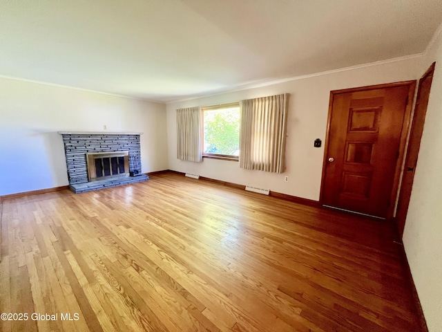 19 Lillian Dr, Glenville, NY 12302 - unfurnished living room featuring crown molding, wood finished floors, a fireplace, and baseboards