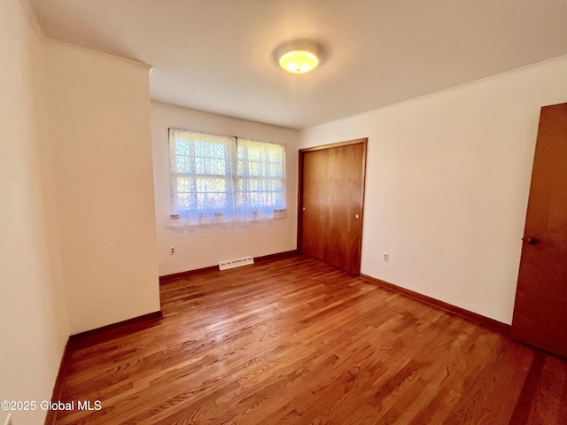 19 Lillian Dr, Glenville, NY 12302 - unfurnished bedroom with wood finished floors, a closet, and baseboards