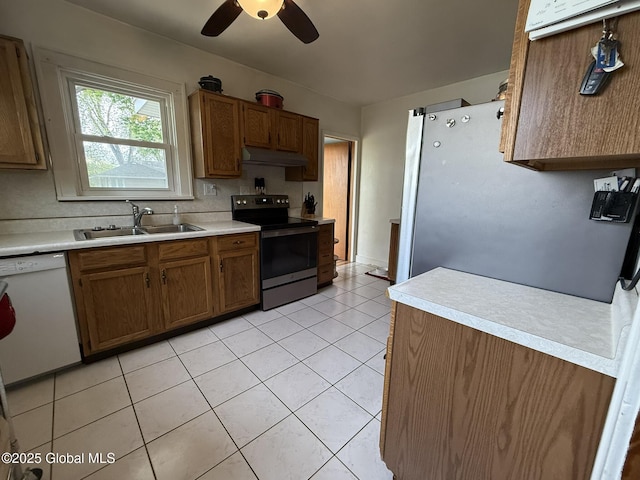 8 Hackett St, Bethlehem, NY 12158 - kitchen with appliances with stainless steel finishes, under cabinet range hood, a sink, ceiling fan, and brown cabinets