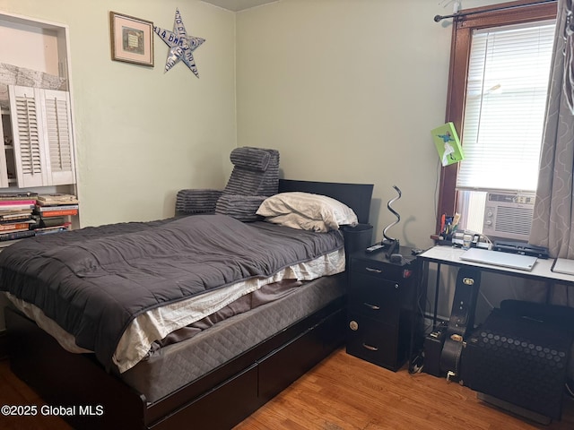 8 Hackett St, Bethlehem, NY 12158 - bedroom with light wood-style floors, a desk, and cooling unit