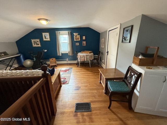 8 Hackett St, Bethlehem, NY 12158 - bedroom featuring light wood finished floors, lofted ceiling, and a baseboard radiator