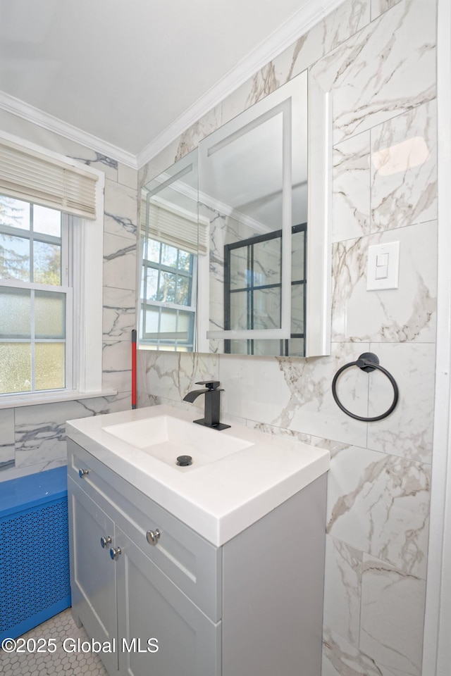 1123 Ardsley Rd, Schenectady, NY 12308 - bathroom with tile walls, crown molding, and vanity