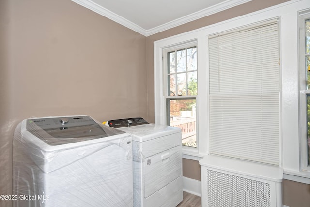 1123 Ardsley Rd, Schenectady, NY 12308 - laundry room featuring separate washer and dryer, ornamental molding, plenty of natural light, radiator heating unit, and baseboards