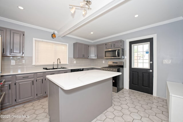 1123 Ardsley Rd, Schenectady, NY 12308 - kitchen with stainless steel appliances, gray cabinets, a sink, light countertops, and ornamental molding