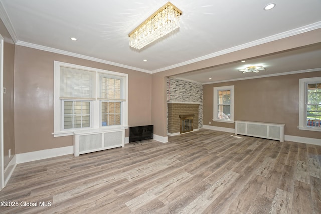 1123 Ardsley Rd, Schenectady, NY 12308 - unfurnished living room with wood finished floors, ornamental molding, baseboards, radiator heating unit, and recessed lighting