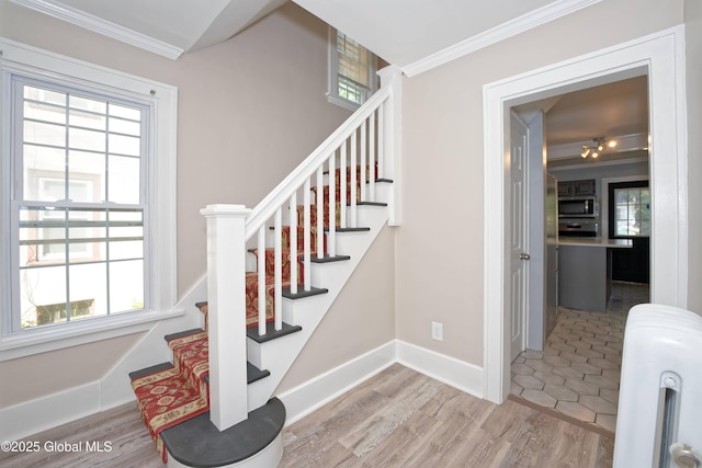 1123 Ardsley Rd, Schenectady, NY 12308 - stairway with ornamental molding, baseboards, and wood finished floors
