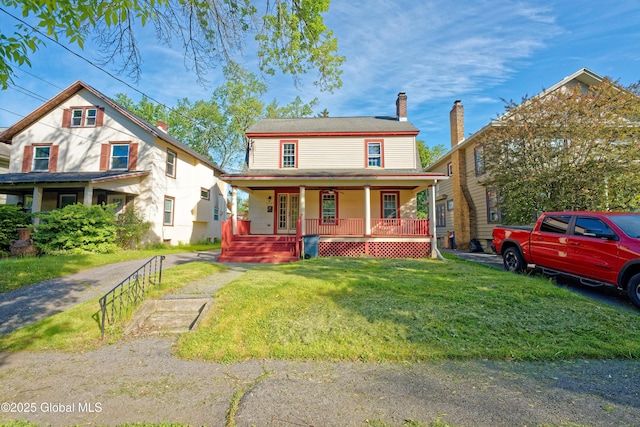 1123 Ardsley Rd, Schenectady, NY 12308 - view of front of home featuring covered porch, a front lawn, and a chimney