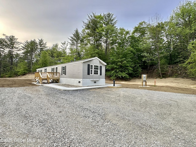 6041 Rte 9n, Hadley, NY 12835 - view of front of property featuring a deck and view of wooded area