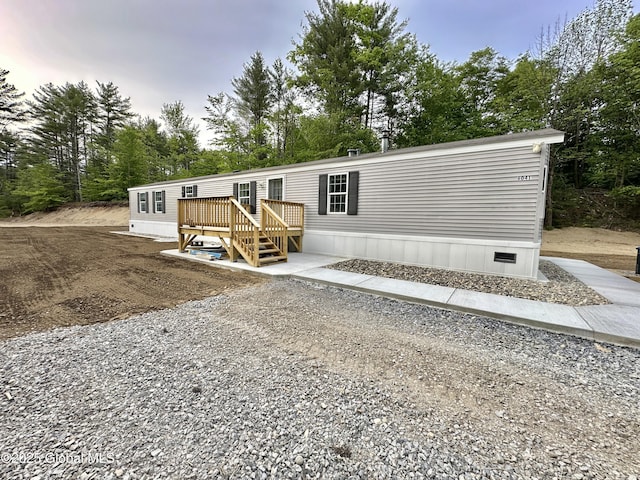 6041 Rte 9n, Hadley, NY 12835 - manufactured / mobile home featuring a deck, view of scattered trees, and crawl space
