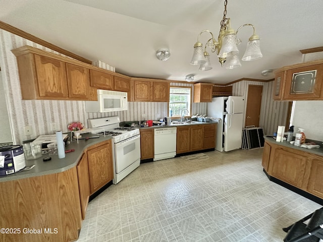 6041 Rte 9n, Hadley, NY 12835 - kitchen featuring white appliances, wallpapered walls, brown cabinetry, hanging light fixtures, and a sink