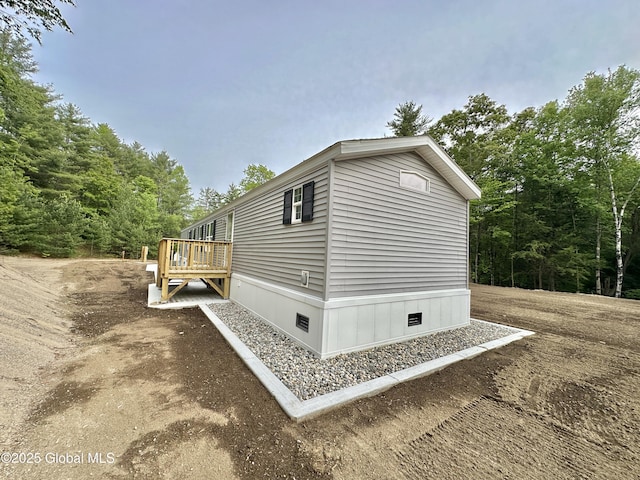 6041 Rte 9n, Hadley, NY 12835 - view of side of property featuring crawl space and a deck