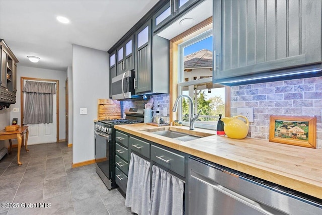 30 Overlook Ct, Claverack, NY 12534 - kitchen with wooden counters, a sink, appliances with stainless steel finishes, and tasteful backsplash