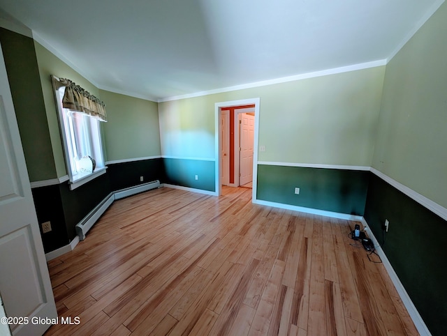 258 Middle Rd, Crown Point, NY 12928 - unfurnished room featuring wood finished floors, baseboard heating, ornamental molding, and baseboards