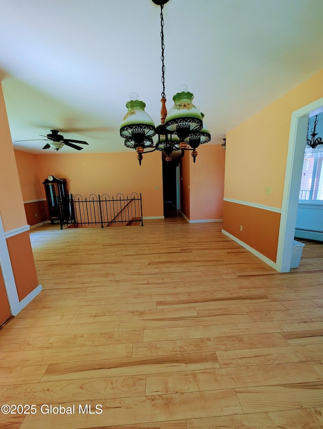 258 Middle Rd, Crown Point, NY 12928 - empty room featuring light wood finished floors, a baseboard radiator, and baseboards