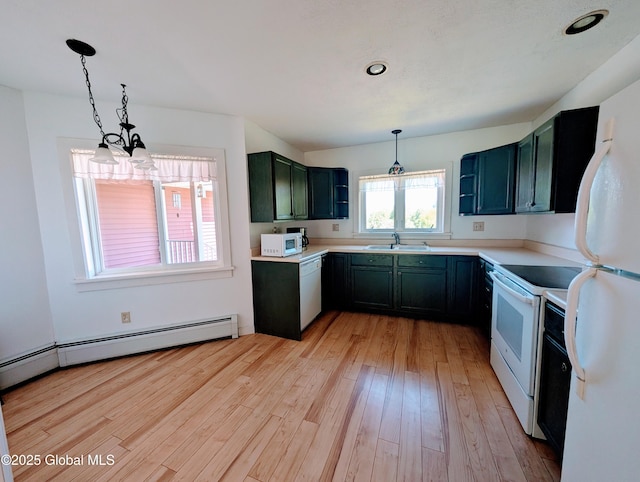 258 Middle Rd, Crown Point, NY 12928 - kitchen featuring white appliances, light wood finished floors, pendant lighting, a sink, and light countertops