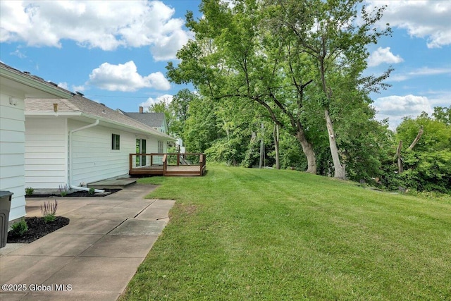 55 Fairview Ave, Hudson, NY 12534 - view of green lawn featuring a wooden deck and a patio