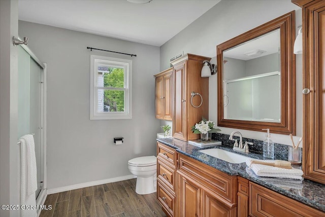 55 Fairview Ave, Hudson, NY 12534 - bathroom with vanity, a shower stall, toilet, baseboards, and wood finished floors