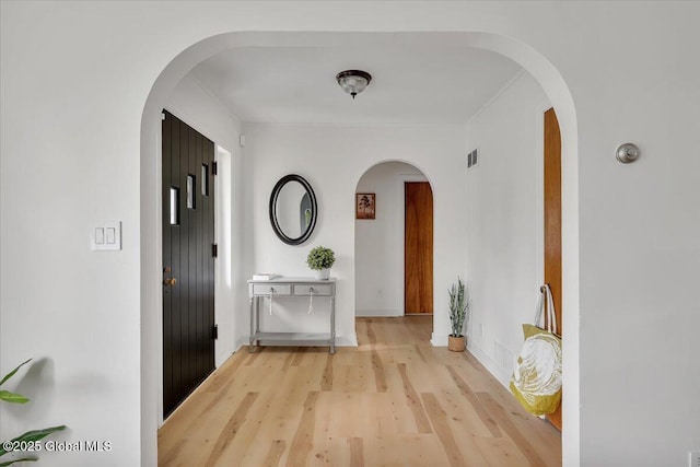 55 Fairview Ave, Hudson, NY 12534 - corridor with arched walkways and light wood-style flooring
