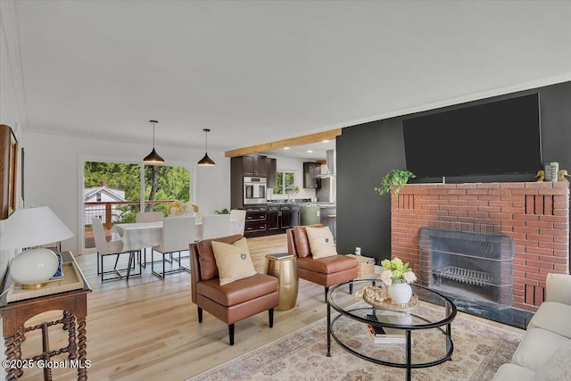 55 Fairview Ave, Hudson, NY 12534 - living area with light wood-style floors and a fireplace