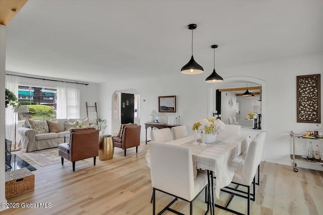 55 Fairview Ave, Hudson, NY 12534 - dining space featuring arched walkways and light wood-style floors