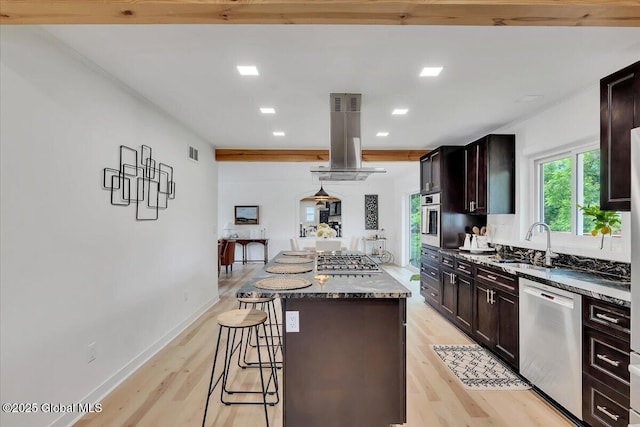 55 Fairview Ave, Hudson, NY 12534 - kitchen with stainless steel appliances, island range hood, a sink, a center island, and a kitchen bar