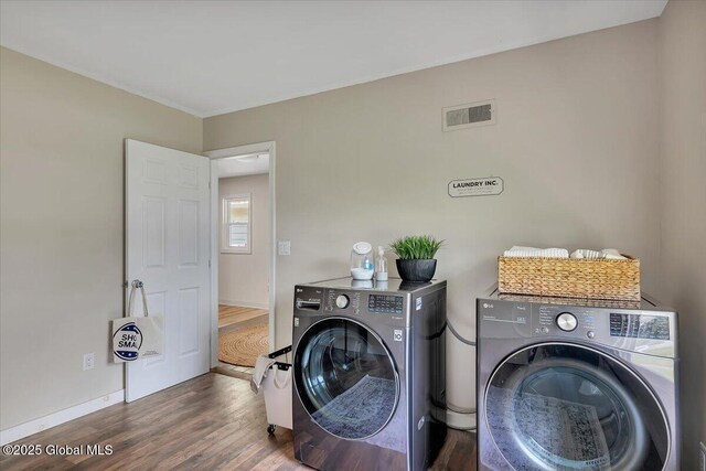 55 Fairview Ave, Hudson, NY 12534 - washroom with washing machine and dryer, wood finished floors, and baseboards