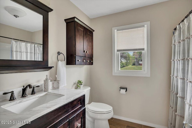 55 Fairview Ave, Hudson, NY 12534 - full bathroom featuring vanity, toilet, baseboards, and wood finished floors