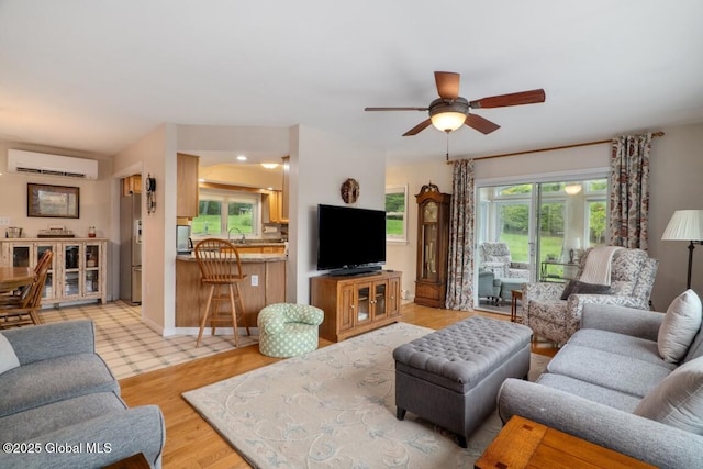 440 Posson Hill Rd, Middleburgh, NY 12122 - living area with a wall mounted AC, ceiling fan, and light wood finished floors