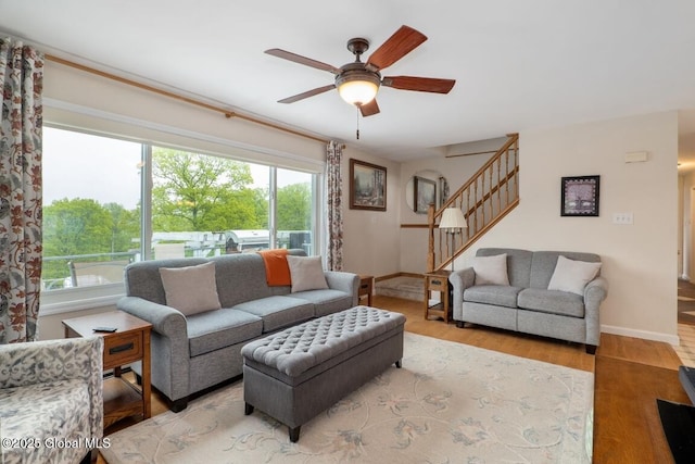440 Posson Hill Rd, Middleburgh, NY 12122 - living area featuring healthy amount of natural light, stairway, a ceiling fan, and wood finished floors