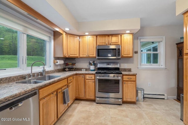 440 Posson Hill Rd, Middleburgh, NY 12122 - kitchen with appliances with stainless steel finishes, a baseboard radiator, a sink, recessed lighting, and light stone countertops