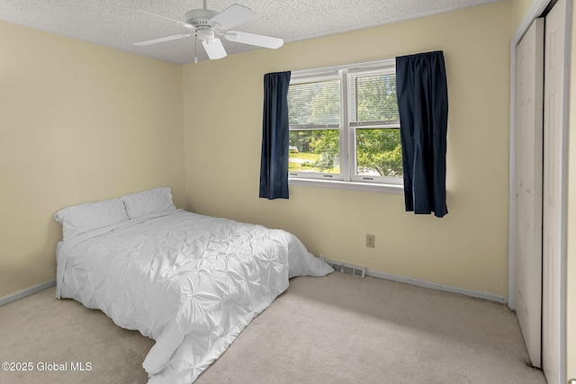 228 Vincenza Ln, Guilderland, NY 12303 - carpeted bedroom featuring a textured ceiling, a closet, and ceiling fan