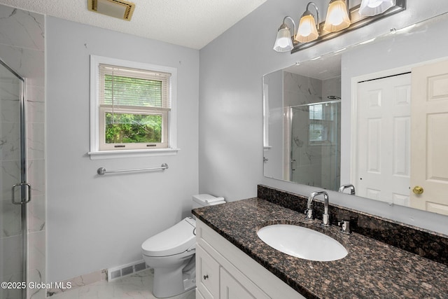 228 Vincenza Ln, Guilderland, NY 12303 - full bathroom with marble finish floors, vanity, a stall shower, and a textured ceiling