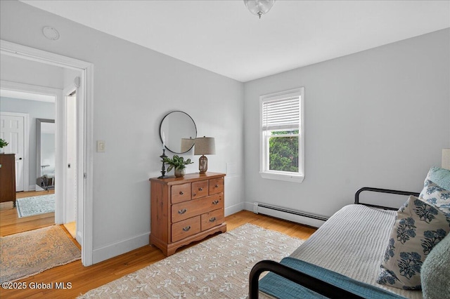 14 Grounds Pl, Colonie, NY 12205 - bedroom featuring baseboard heating and light wood-style flooring