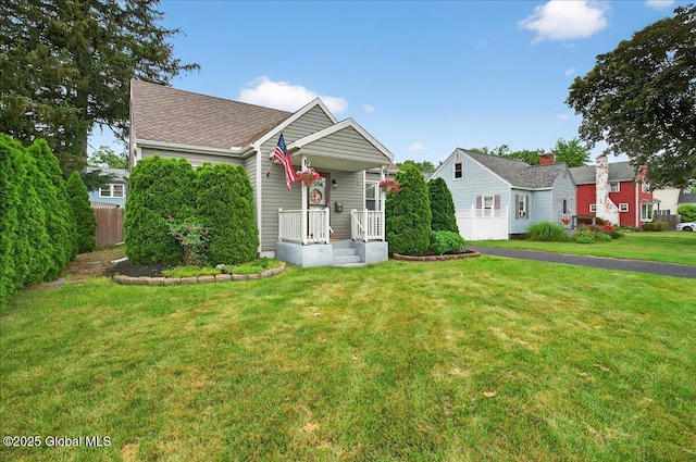 14 Grounds Pl, Colonie, NY 12205 - view of front facade with a shingled roof and a porch