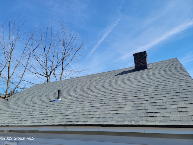 254 Church St, Amsterdam, NY 12010 - exterior view of a chimney and roof with shingles