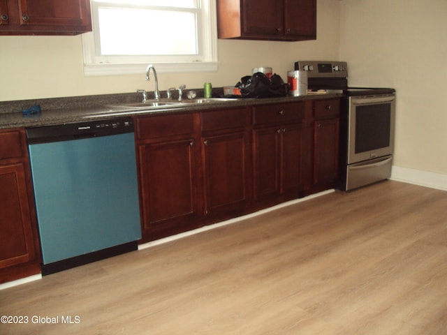 254 Church St, Amsterdam, NY 12010 - kitchen with dishwasher, electric range, dark countertops, light wood-type flooring, and reddish brown cabinets
