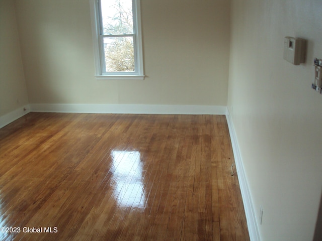 254 Church St, Amsterdam, NY 12010 - spare room featuring wood-type flooring and baseboards