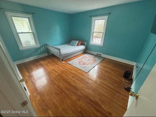 254 Church St, Amsterdam, NY 12010 - bedroom with wood finished floors and baseboards