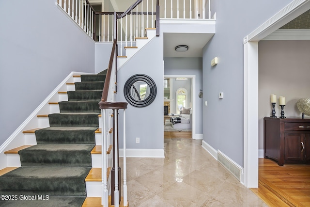 17 Brendan Ln, Niskayuna, NY 12309 - stairs with a towering ceiling and baseboards