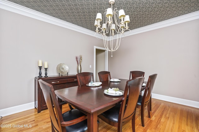 17 Brendan Ln, Niskayuna, NY 12309 - dining room with baseboards, a chandelier, an ornate ceiling, light wood finished floors, and crown molding