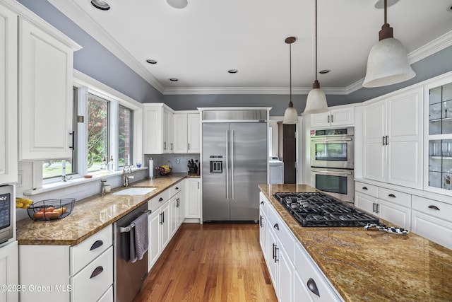 17 Brendan Ln, Niskayuna, NY 12309 - kitchen with stainless steel appliances, a sink, white cabinets, and ornamental molding